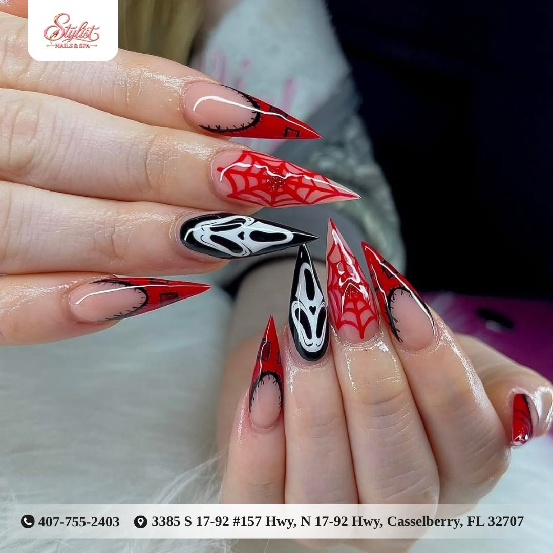 Red spiderweb and character nail art at Stylist Nails & Spa
