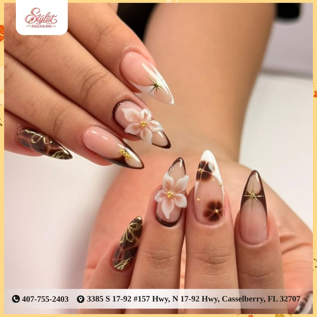 3D blossom and gold star nail art